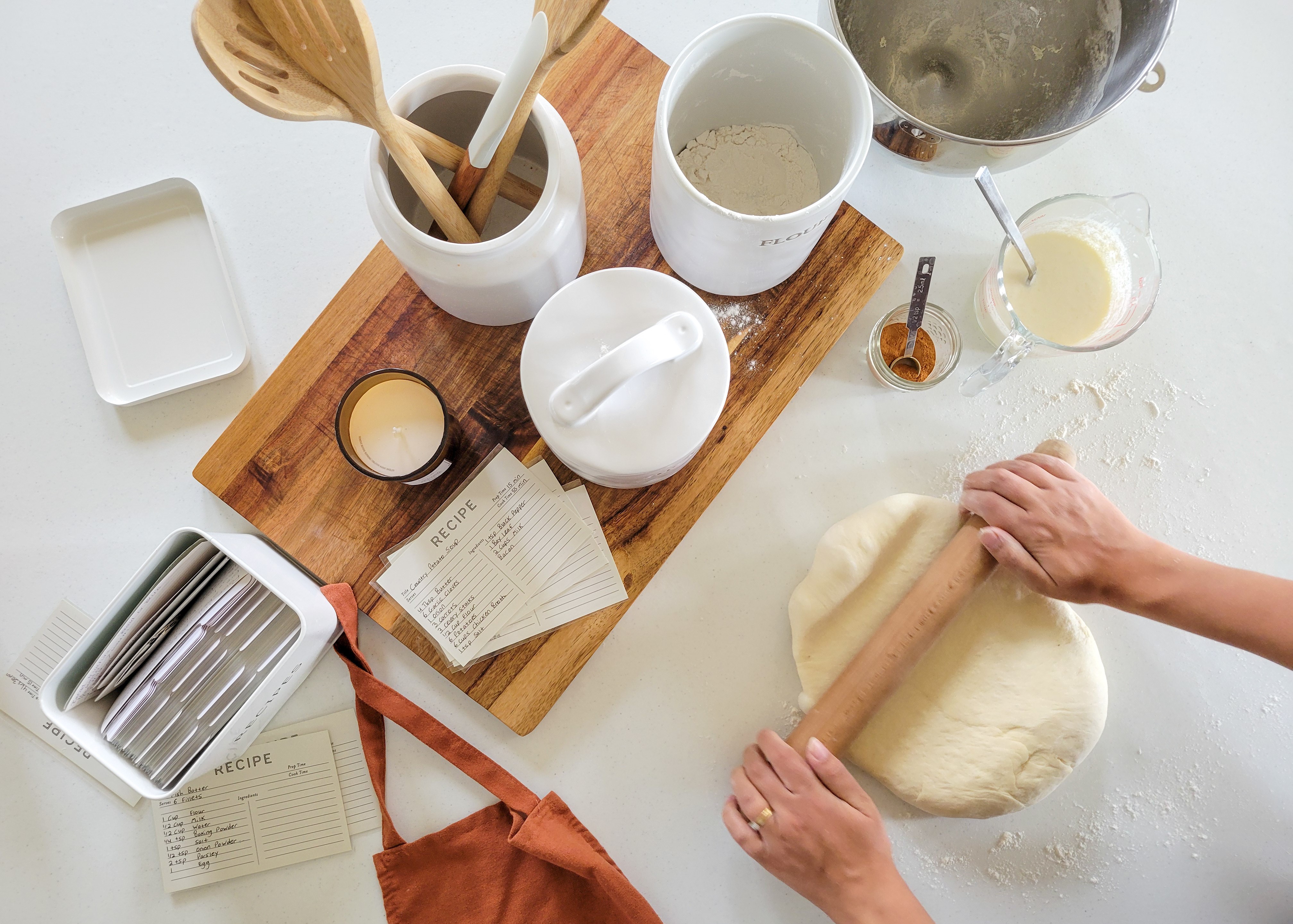 Baker scoring fresh sourdough bread